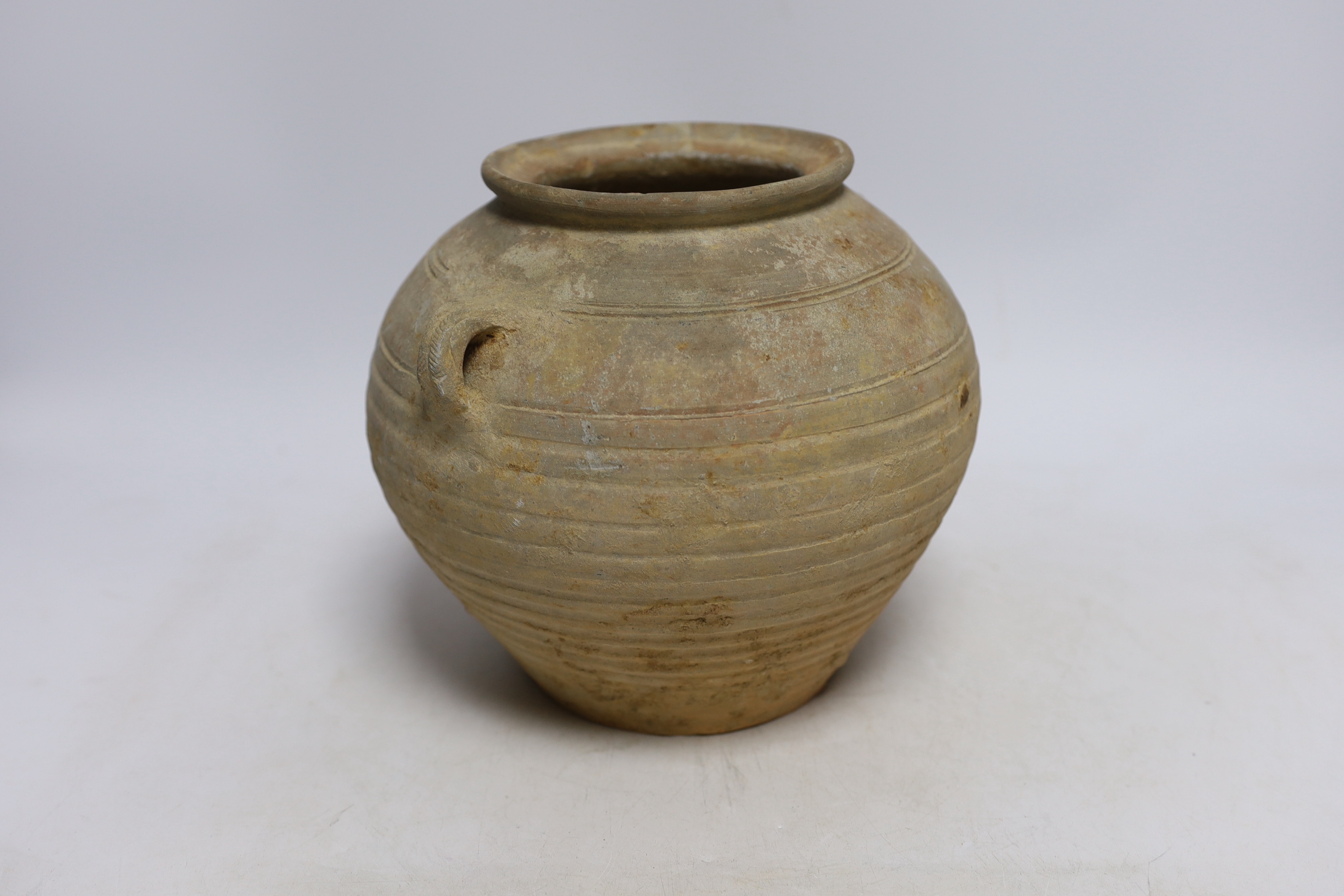 A Chinese grey pottery jar, Han dynasty, 19cm high